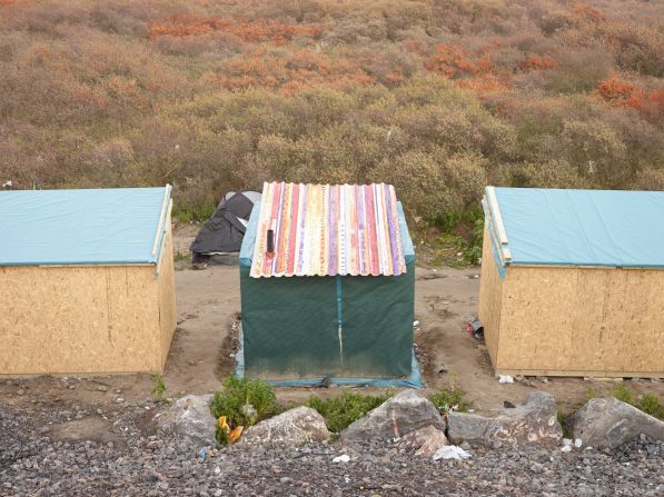 "The Dutch photographer Henk Wildschut has been documenting impromptu settlements in Calais, France with startling images that speak to the resiliency of peoples," writes  Anderson.