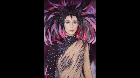 Throughout her career, Cher has always been known for her flamboyant fashion. Here, she wears a feathered headdress for "The Sonny and Cher Comedy Hour" in 1972. 