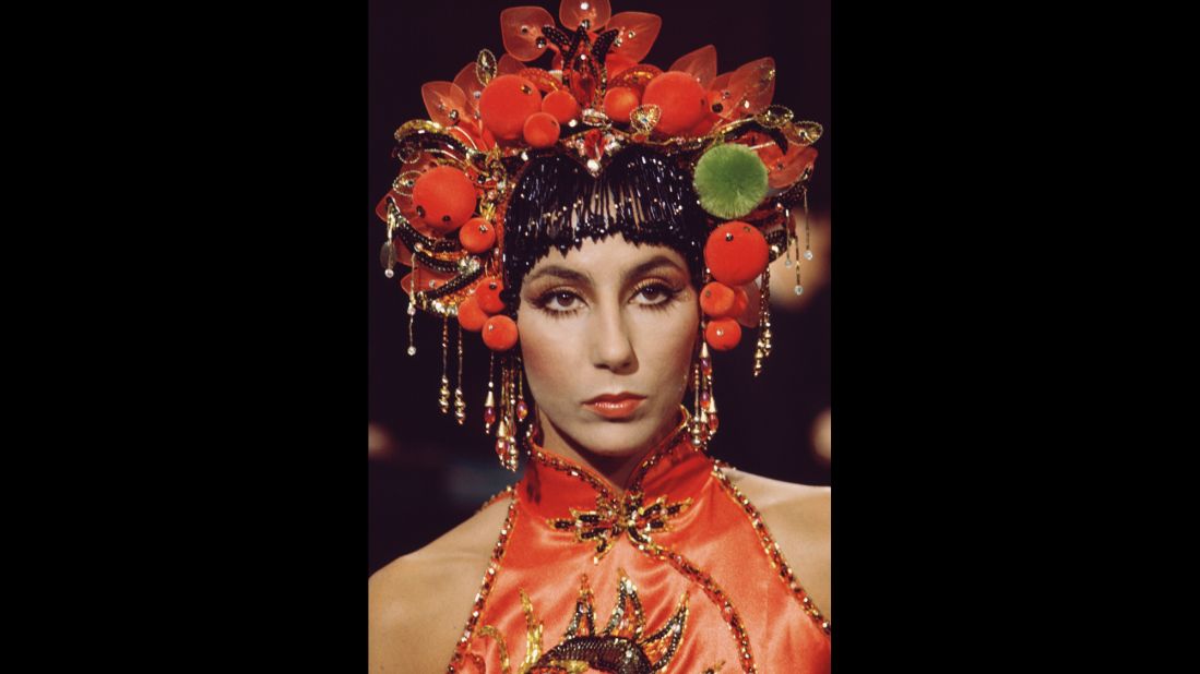 Cher wears an Asian-styled headdress and a sleeveless satin top for her show in 1972.