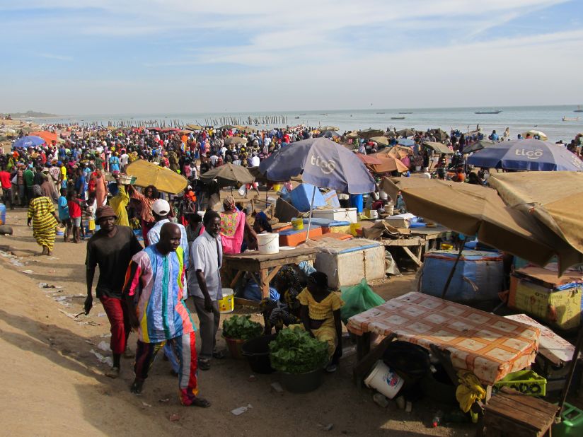 A rush of activity comes with the arrival of fishing boats in Mbour, just down the road from Saly.