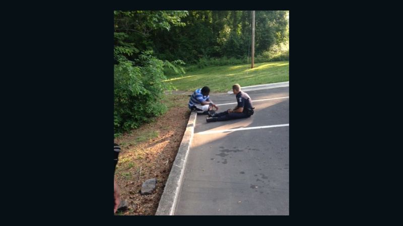 Charlotte Photo Of Police Officer Consoling Teen Goes Viral Cnn 
