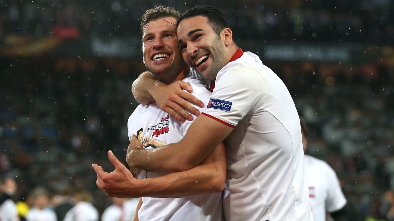 Sevilla's Kevin Gameiro, left, and Adil Rami celebrate their 3-1 victory over Liverpool in the Europa League final, which was played Wednesday, May 18, in Basel, Switzerland.  The Spanish club has now won the tournament for the third consecutive season.