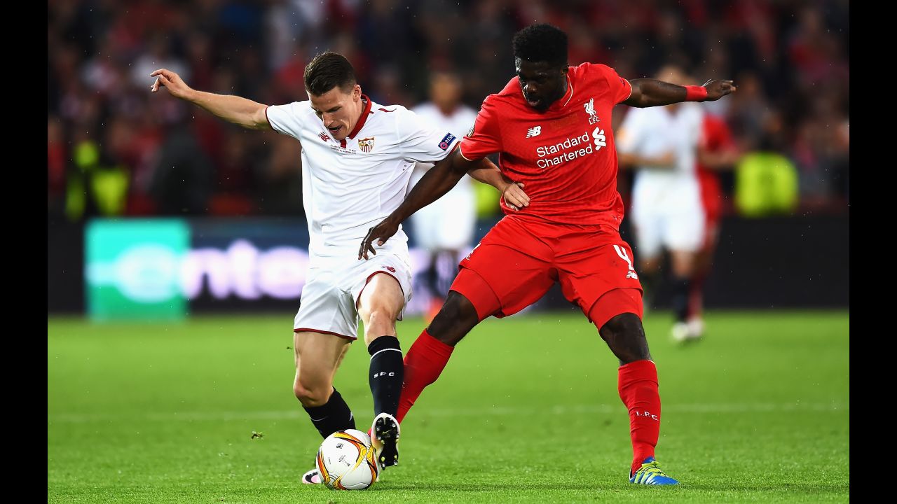 Gameiro competes for the ball with Liverpool's Kolo Toure.