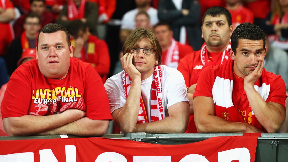 Liverpool supporters appear dejected during the match.
