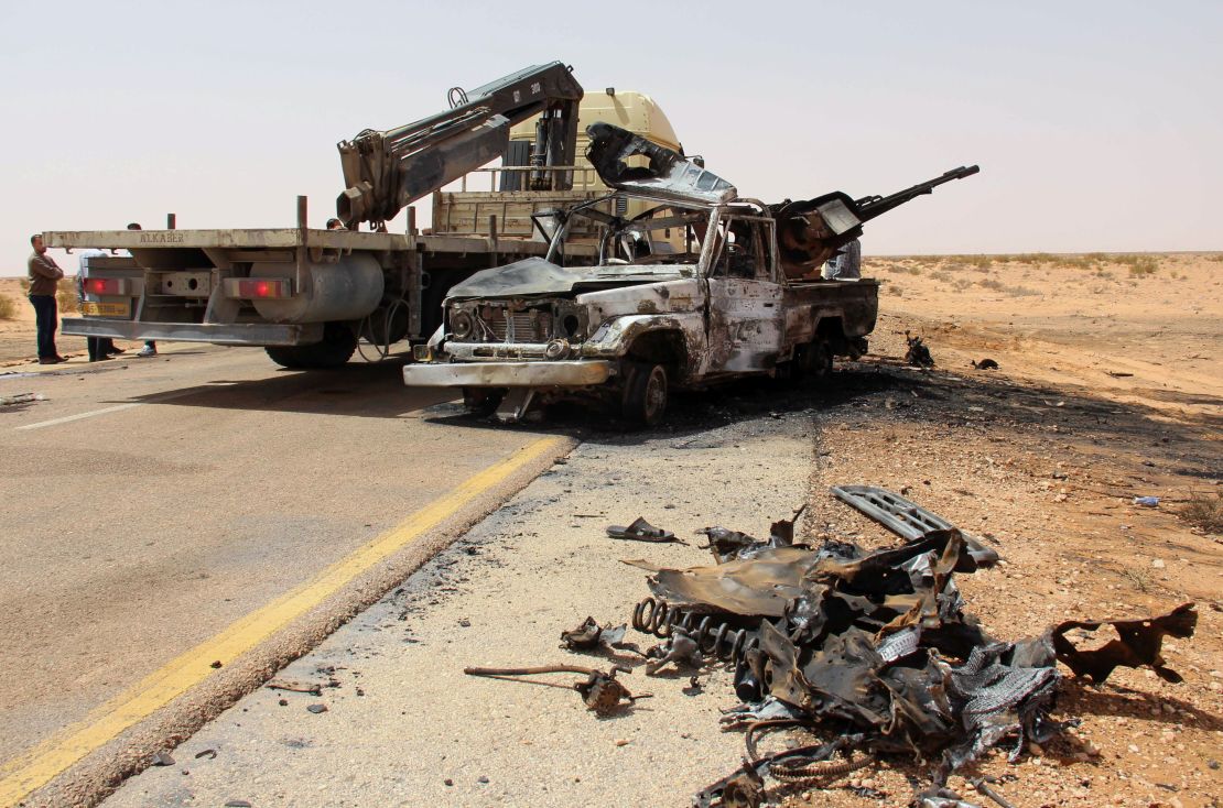 A truck removes the wreckage following a bomb attack near Misrata in April.