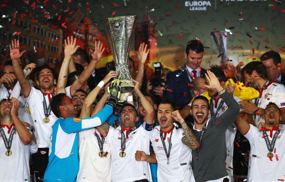 Captain Jose Antonio Reyes (C) of Sevilla is seen lifting the Europa League trophy in celebration on May 18, 2016 in Basel, Switzerland.