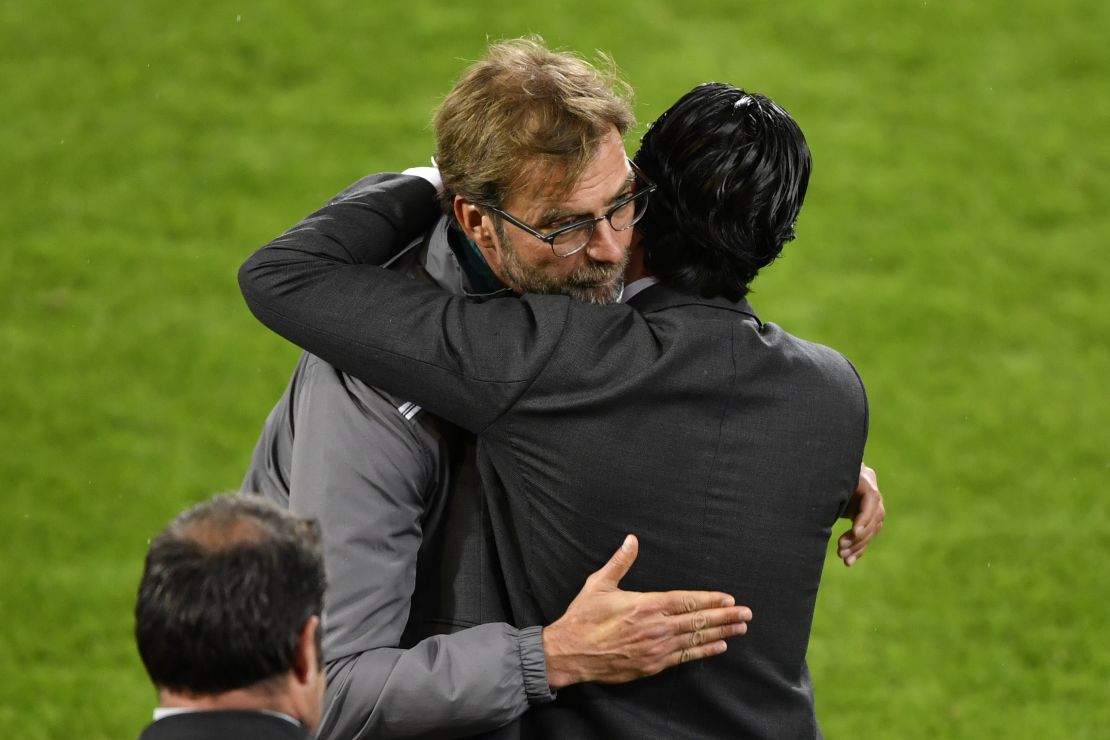 Sevilla coach, Unai Emery (R), hugs his Liverpool counterpart, Jurgen Klopp, after Sevilla won the Europa League final.