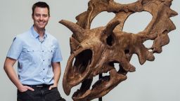 Dr. Jordan Mallon palaeontologist with the Canadian Musuem of Nature stands with the reconstructed skull of Spiclypeus shipporum, a newly described species of horned dinosaur.