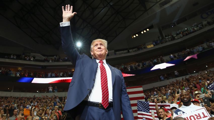 Republican presidential candidate Donald Trump waves to the audience gathered for a campaign rally at the American Airlines Center on September 14, 2015 in Dallas, Texas. More than 20,000 tickets have been distributed for the event.