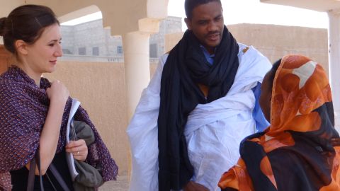 Maitre Mohameden Elid, center, and Sarah Mathewson, left, helped bring a successful slavery case to court in Mauritania, according to Anti-Slavery International. They are pictured with a victim of slavery who was not involved in that case. 
