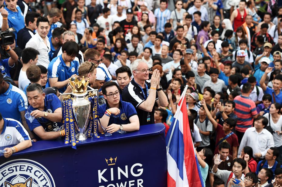 Leicester City manager Claudio Ranieri (center) gives a traditional Thai "wai" gesture of welcome as fans of the English Premier League soccer champions greet the Thai-owned team in Thailand's capital, Bangkok. Ranieri steered Leicester, owned by billionaire businessman Vichai Srivaddhanaprabha, to the most unlikely triumph in Premier League history as it won the competition by 10 points from second-placed Arsenal. Jon Sanders, the Leicester player liaison officer, <a href="http://www.leicestermercury.co.uk/Leicester-City-parade-Premier-League-trophy/story-29294144-detail/story.html" target="_blank" target="_blank">told the Leicester Mercury newspaper</a>: "One million people on the streets to welcome the Premier League champions in Bangkok. Incredible."