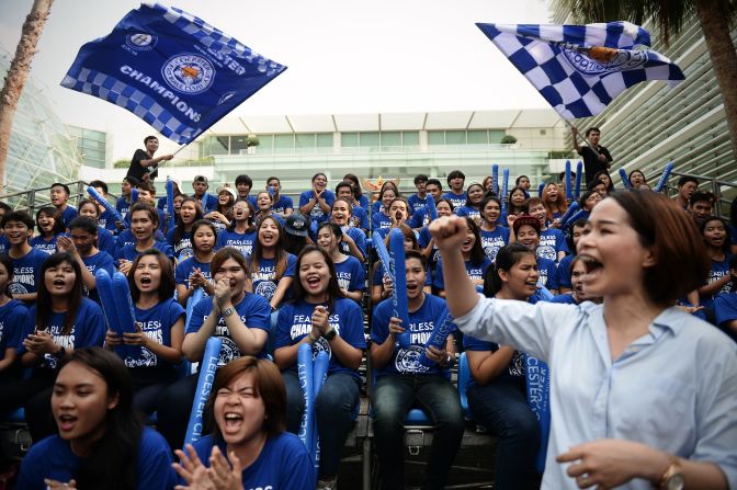 Leicester fans run through a cheerleading routine as they prepare to welcome the victorious Foxes players and staff to the city. Some of Bangkok's major roads were closed to traffic for the parade, which centered on Sukhumvit Road, a street that crosses the city.
