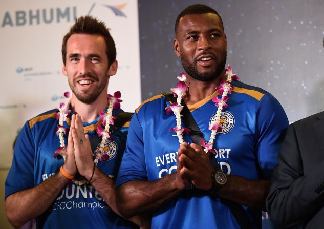 Leicester defenders Christian Fuchs and Morgan, who is the team's captain, greet the press as the squad arrive at Suvarnabhumi Airport in Bangkok. Morgan said:  "We're always extremely proud to come here and we know how much it means to the owners, who have done so much for the club in the last six years."