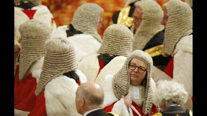 Members of the Law Lords, Britain's senior judiciary, take their seats as they wait for Queen Elizabeth II to speak at the opening of Parliament on Wednesday, May 18.