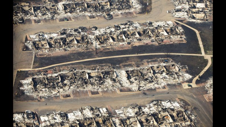 An aerial photo shows a devastated neighborhood in Fort McMurray, Alberta, on Friday, May 13. The mammoth inferno devastating northern Alberta <a href="http://www.cnn.com/2016/05/18/americas/alberta-wildfire-canada-fort-mcmurray/" target="_blank">has destroyed more than 877,000 acres. </a>That's more than four times the size of New York City.