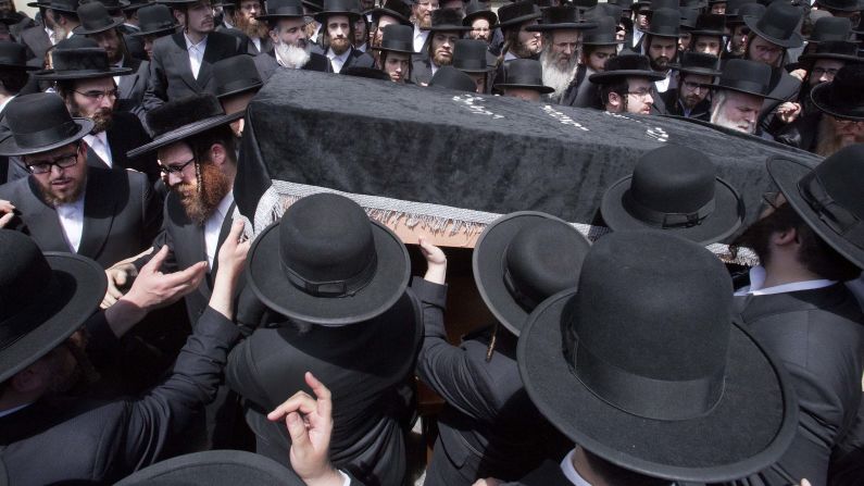 Mourners carry the coffin of Isaac Rosenberg, a leader of the Satmar Hasidic congregation, following his funeral in New York on Wednesday, May 18. Rosenberg and another rabbi, Chaim Parnes, drowned after getting caught in a rip current in Miami, <a href="http://www.miamiherald.com/news/local/community/miami-dade/article78134277.html" target="_blank" target="_blank">according to the Miami Herald.</a> Rosenberg was 67 and Parnes was 66.