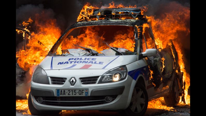 A police car burns in Paris on Wednesday, May 18. Two officers <a href="http://www.cnn.com/2016/05/18/europe/police-car-fire-paris-hatred-protest/" target="_blank">escaped with minor injuries</a> after Molotov cocktails were thrown at their rear windshield, a police spokesperson said. The attack came on the same day that the national police union demonstrated against anti-police sentiment.