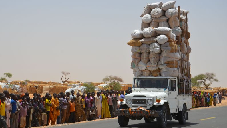 An overloaded car travels through the Assaga refugee camp in Diffa, Niger, on Tuesday, May 17. More than 240,000 people are in Niger camps after being displaced by the Nigerian terrorist group Boko Haram.