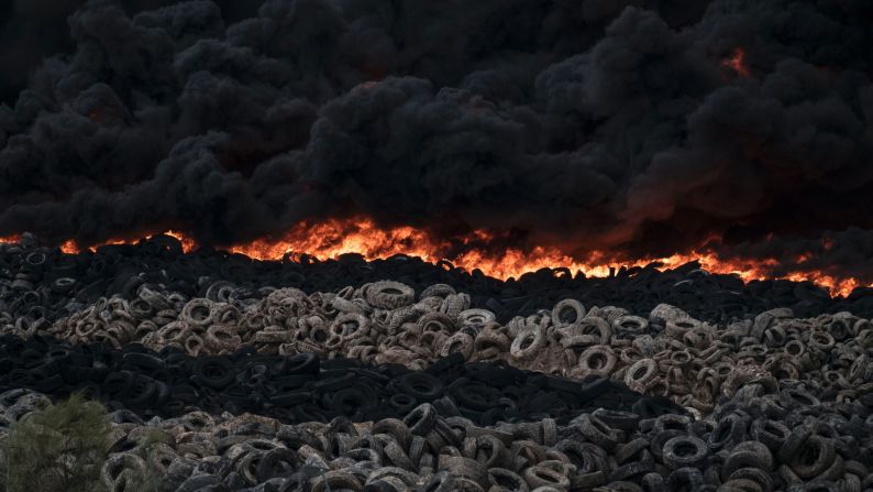 Tires burn at a dump near the Spanish town of Sesena on Friday, May 13. Officials worried that the toxic fumes could harm nearby residents, and areas were evacuated.
