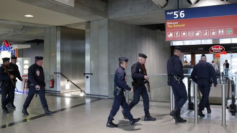 Police officers patrol at Charles de Gaulle airport, outside of Paris, Thursday, May 19, 2016. 