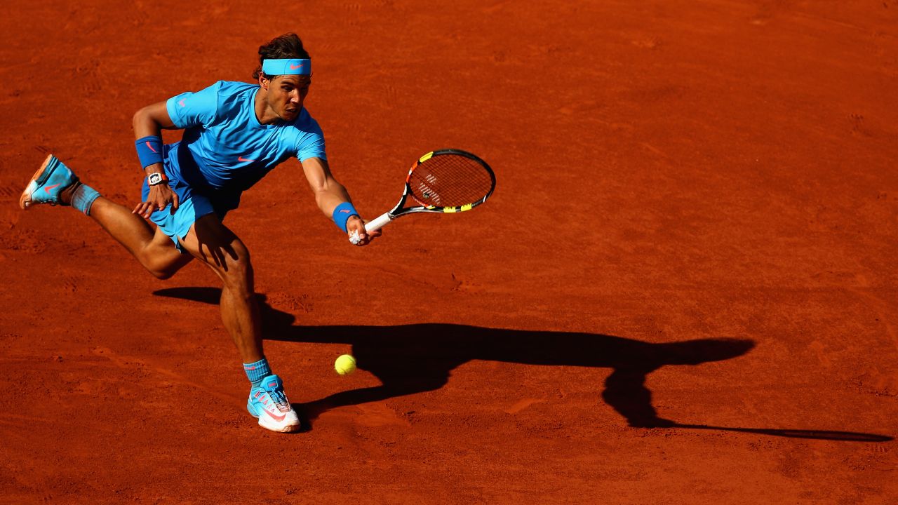 PARIS, FRANCE - JUNE 03:  Rafael Nadal of Spain plays a forehand in his Men's quarter final match against Novak Djokovic of Serbia on day eleven of the 2015 French Open at Roland Garros on June 3, 2015 in Paris, France.  (Photo by Clive Brunskill/Getty Images)