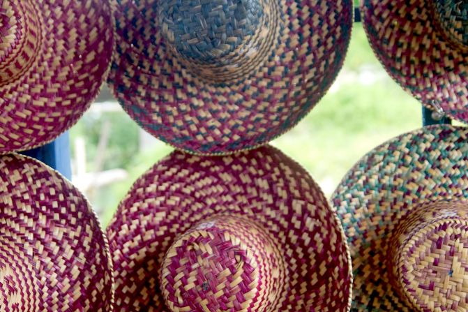 At the Rammang-Rammang village jetty, enterprising locals rent sunhats for a few cents apiece.