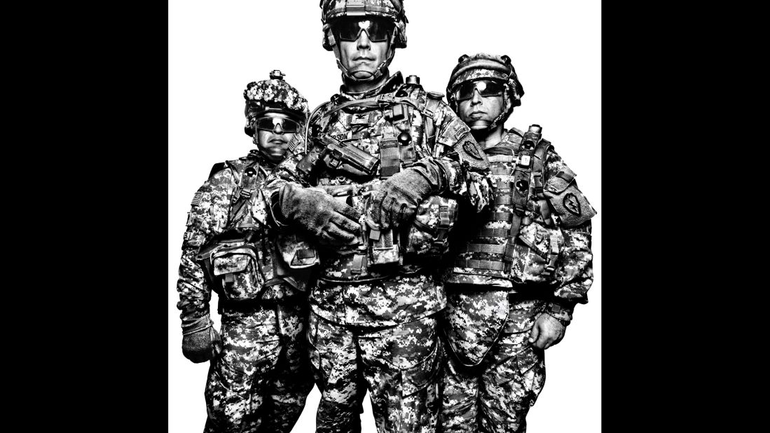 The portraits in the book "Service" focus on U.S. military members and their families. From left are three members of the U.S. Army's 1st Stryker Brigade Combat Team in 2008: Command Sgt. Maj. Gabriel Cervantes, Col. Burt Thompson and interpreter John Mardo.