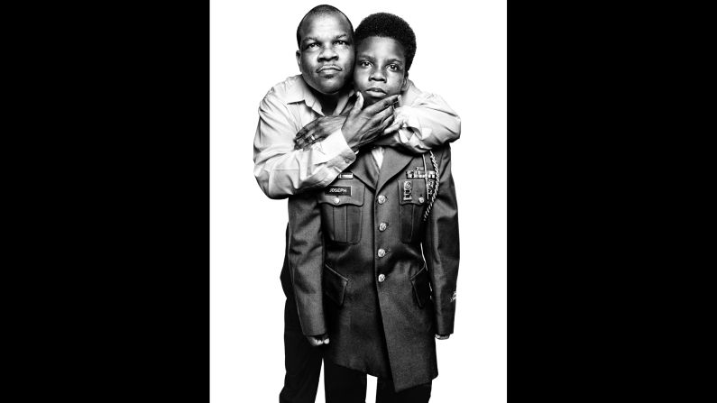 Hilarion Warren Joseph, a decorated veteran of the first Gulf War, poses with his son, Japeri. Japeri's wearing the jacket from his dad's Army uniform.