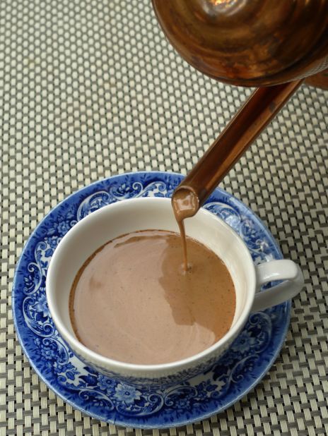 Tsokolate, or thick Filipino hot chocolate, pairs perfectly with sugar-topped cheesebread.
