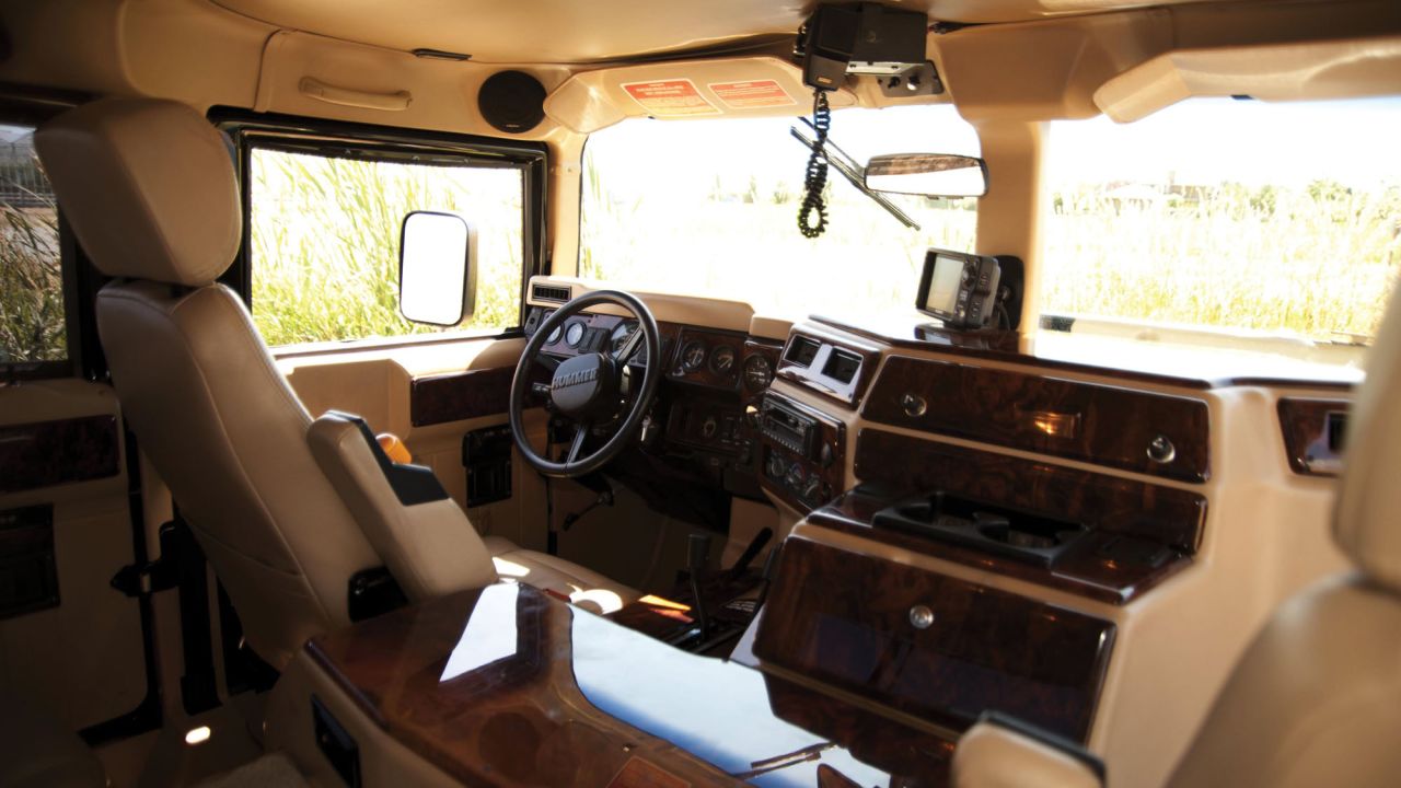 The interior is trimmed in burl wood with beige leather upholstery, and is fit with a 12-disc Clarion sound system, Sony GPS, a central tire inflation system.