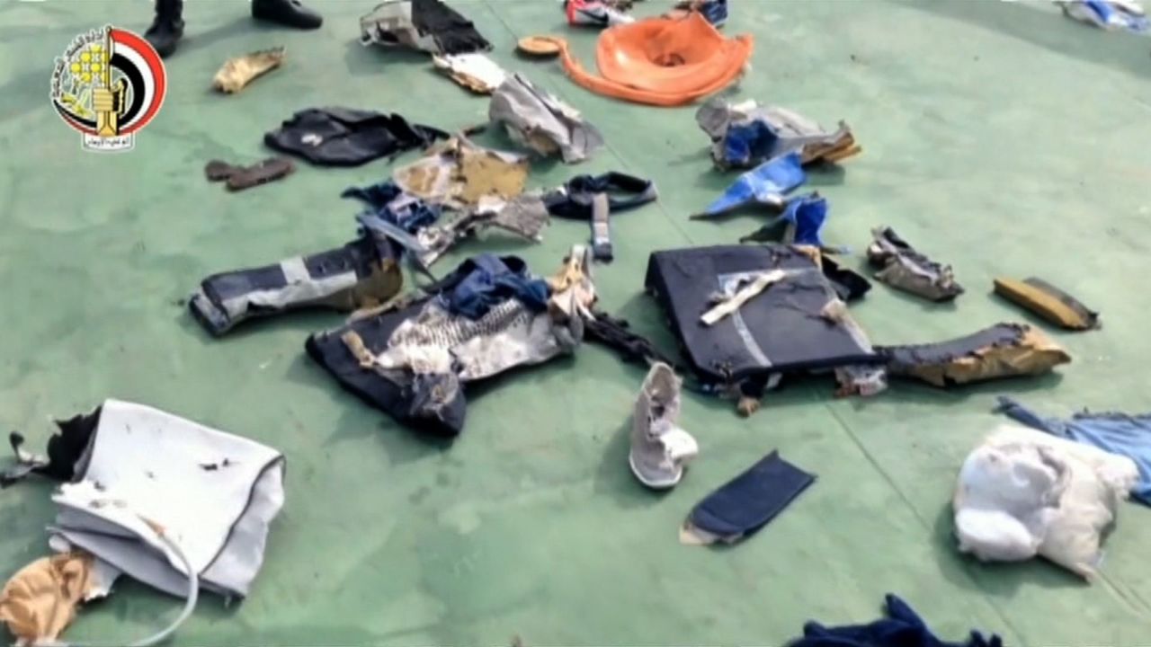 The debris includes passengers' belongings from the plane.