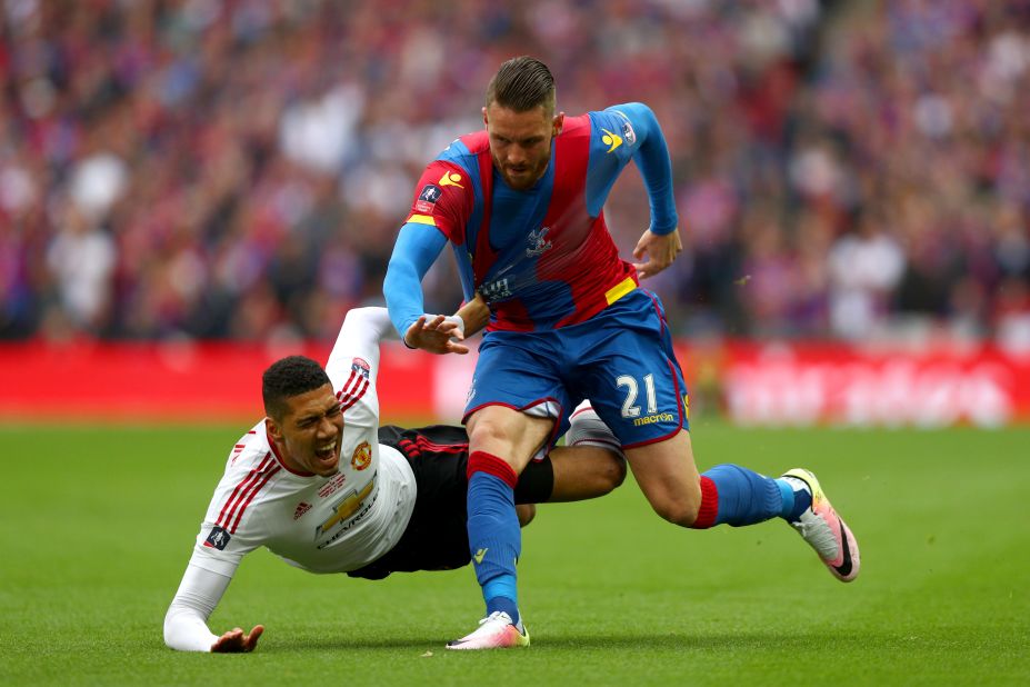 Chris Smalling was booked early on for hauling down Connor Wickham of Crystal Palace.