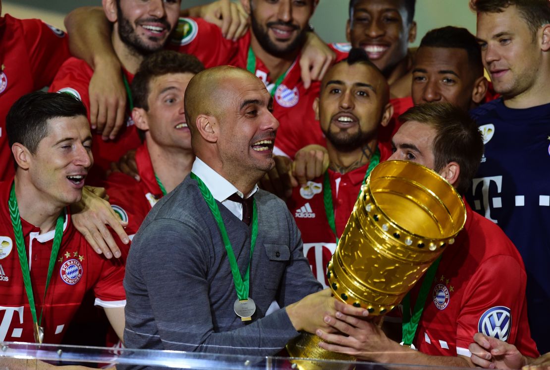 Bayern Munich manager Pep Guardiola celebrates after winning the DFB Pokal final.