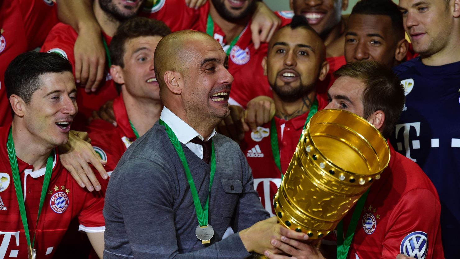 Bayern Munich manager Pep Guardiola celebrates after winning the DFB Pokal final.