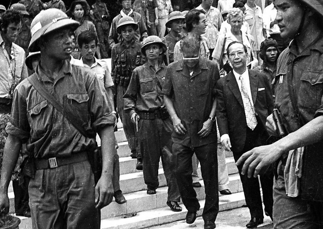 Former Vietnam President Duong Van Minh (C, looking down), leaving the presidential palace in Saigon 30 April 1975.