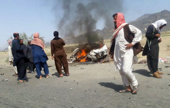 Residents gather around a destroyed car reportedly hit by a drone strike near the town of Ahmad Wal, Pakistan, on Saturday, May 21. Afghan Taliban leader Mullah Akhtar Mohammad Mansour was believed to be traveling in the vehicle. Sources within al Qaeda and the Taliban, reached through an intermediary by CNN, <a >confirmed Mansour's death</a> on Sunday, May 22.