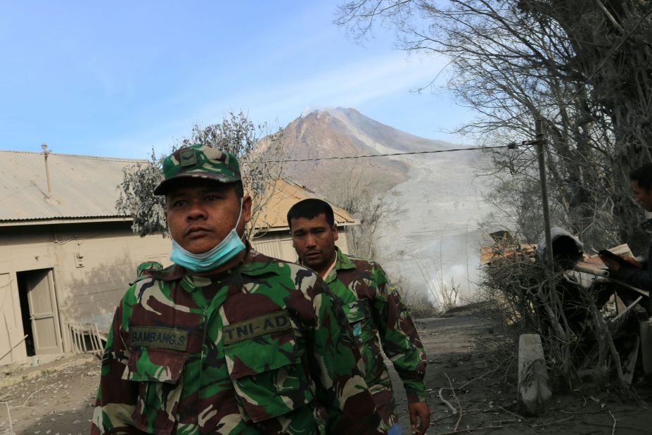 Indonesian soldiers conduct search and rescue operations Sunday, May 22 in a North Sumatra village after the volcano eruption. 