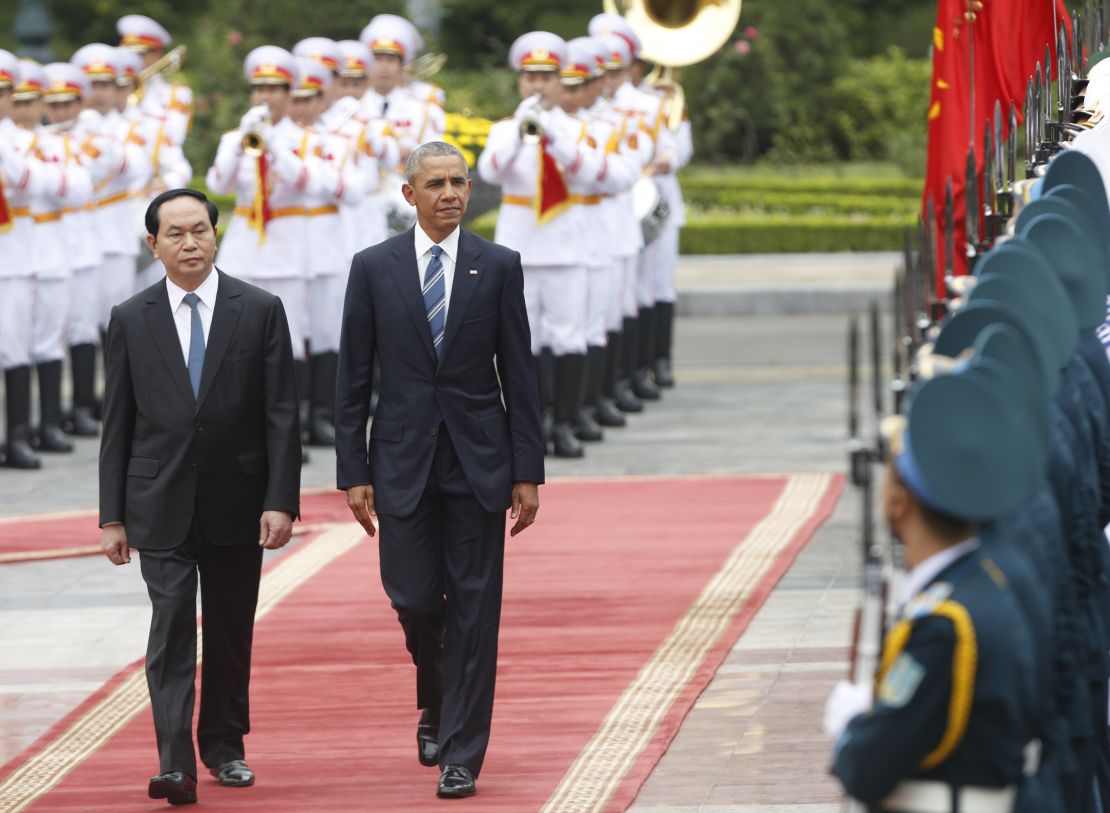 President Obama walks with his Vietnamese counterpart Tran Dai Quang as they review a guard of honour during a welcoming ceremony at the Presidential Palace in Hanoi, Vietnam on May 23, 2016.
