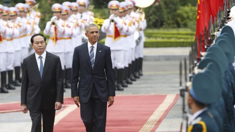 President Obama walks with his Vietnamese counterpart Tran Dai Quang as they review a guard of honour during a welcoming ceremony at the Presidential Palace in Hanoi, Vietnam on May 23, 2016.