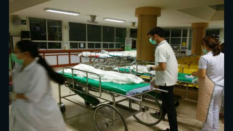 Bodies lie on trolleys awaiting identification after the Sunday night blaze.
