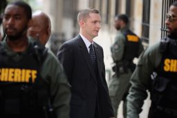  Baltimore Police Officer Edward Nero (C) arrives at the Mitchell Courthouse-West on the day a judge issued an acquittal in his case.