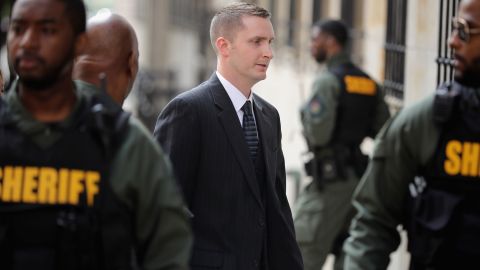 Baltimore Police Officer Edward Nero (C) arrives at the Mitchell Courthouse-West on the day a judge issued an acquittal in his case.