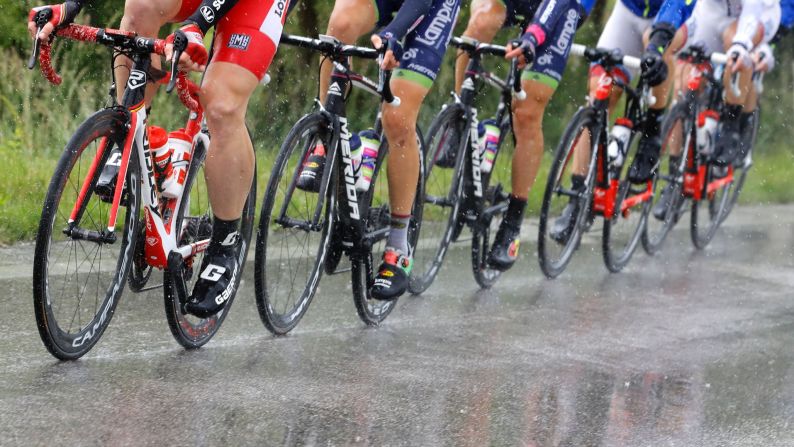 Cyclists ride under heavy rain during the 12th stage of the 99th Giro d'Italia, Tour of Italy, from Noale to Bibione on May 19.