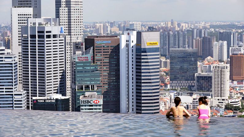 The city's skyline is visible from the pool.