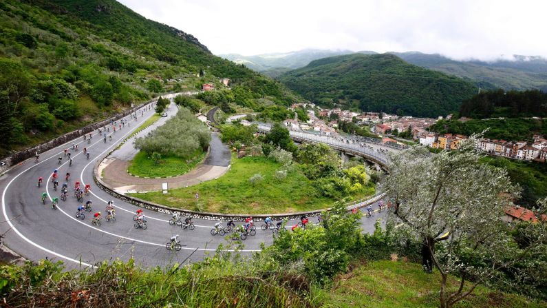 The pack passes a curve on a mountain road during the 7th stage of 99th Giro d'Italia, Tour of Italy, from Sulmona to Foligno of 211 km on May 13, in Foligno, Italy.
