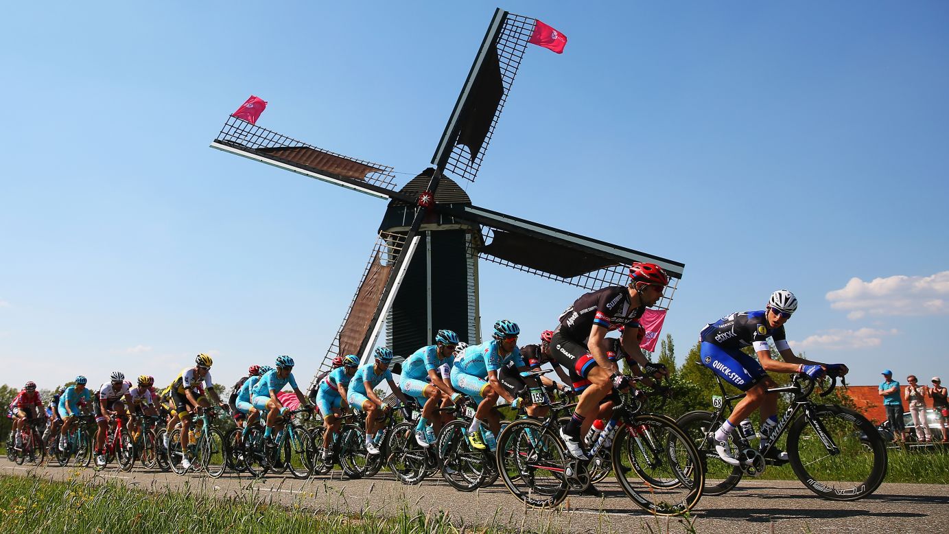 The peloton passes a windmill during stage two of the 2016 Giro d'Italia, a 190km stage from Arnhem to Nijmegen on May 07, in Nijmegen, Netherlands.