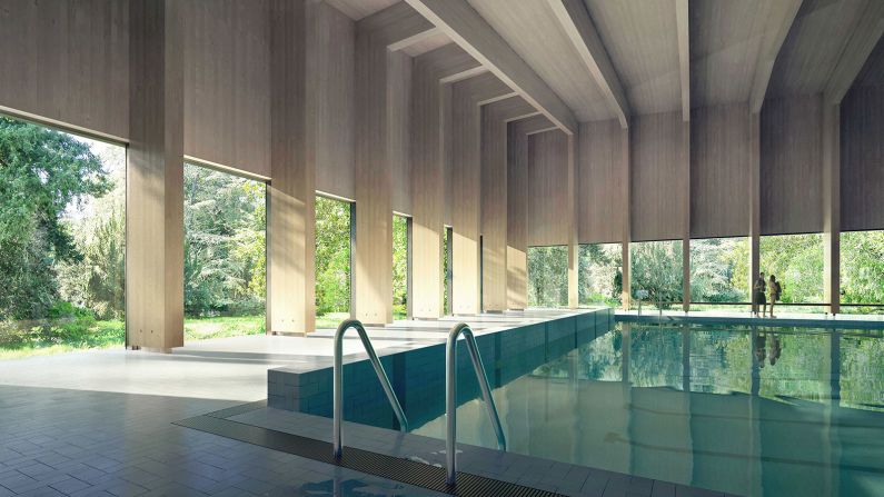 This swimming pool by Hawkins/Brown features a roof made out of timber. 