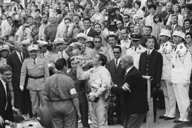 Jackie Stewart refuels after winning the first of his three Monaco titles in 1966. Stewart began his F1 career partnering Hill at the BRM team. "Graham was the man at that time and I learned a lot from him... it was a happy relationship -- he was a gentleman on the race track," Stewart told CNN. 