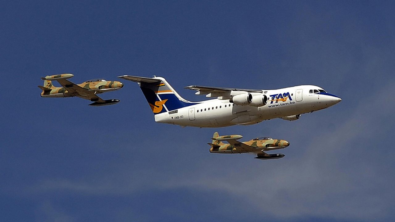 Pictured in 2009, a BAe 146-200, given by President Evo Morales to the Bolivian Air Force, flies over a military airport in La Paz, escorted by military aircraft. 