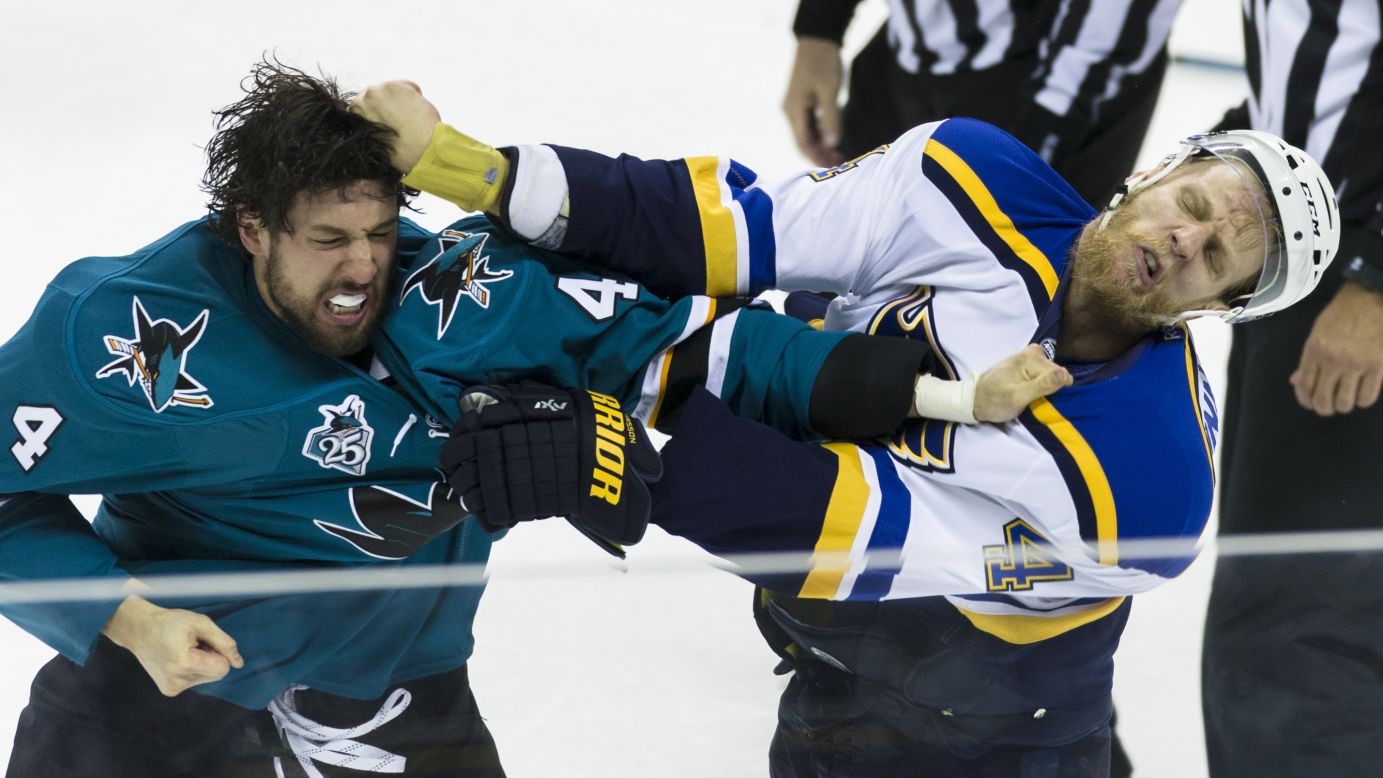 San Jose's Brenden Dillon, left, scraps with St. Louis' Carl Gunnarsson during Game 4 of the NHL's Western Conference Final on Saturday, May 21.